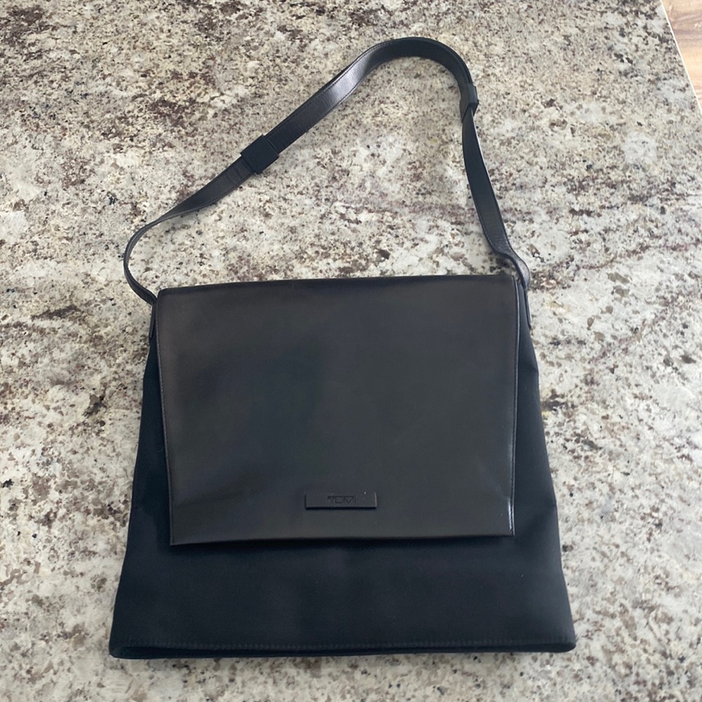 Tumi adjustable strap bag. Like brand new, used for 1 vacation.